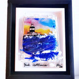 "Handcrafted fused glass art featuring Hook Lighthouse, showcasing vibrant ocean waves, a sunset sky, and a unique double sold wood frame